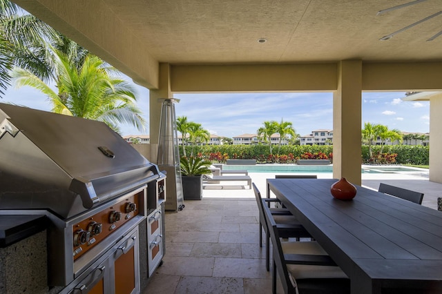 view of patio / terrace featuring ceiling fan and a grill