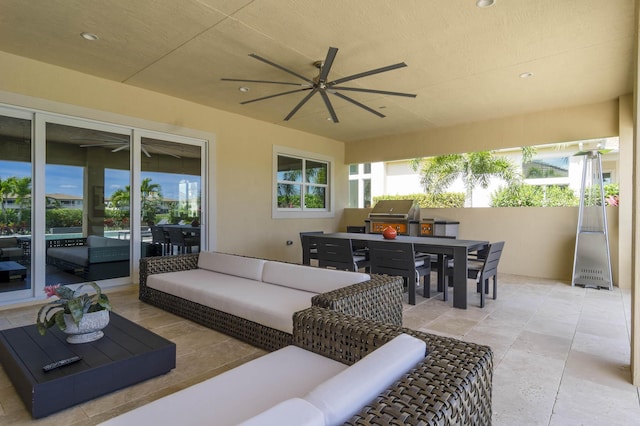 view of patio with an outdoor living space and a grill