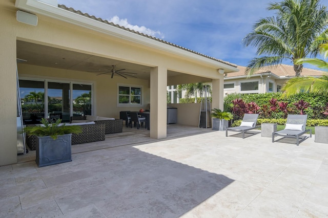 view of patio with ceiling fan and outdoor lounge area