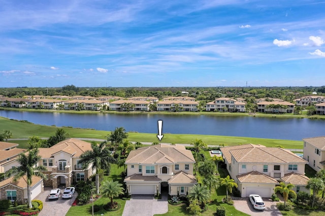 birds eye view of property featuring a water view