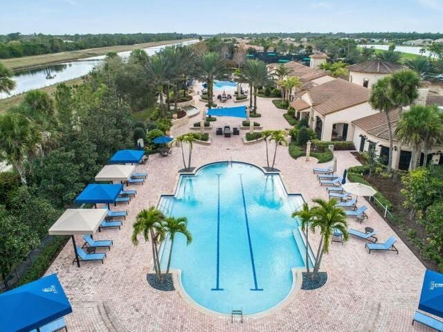 view of pool with a water view