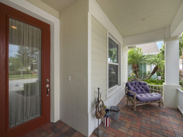 doorway to property featuring covered porch