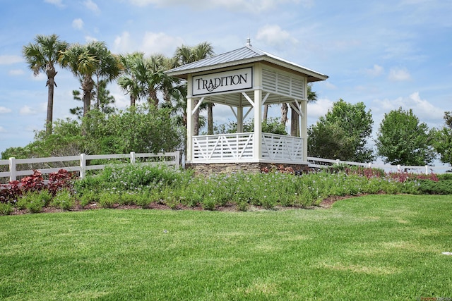 community sign featuring a yard