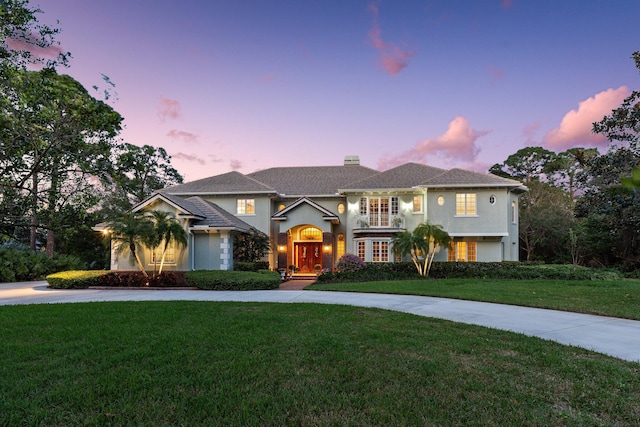 view of front of house with a lawn