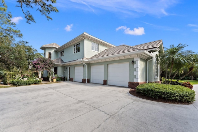 view of side of home featuring a garage