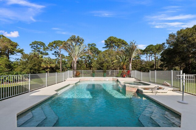 view of pool featuring an in ground hot tub and a patio