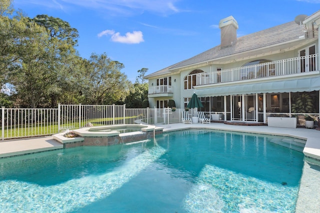 view of pool featuring a patio area and an in ground hot tub