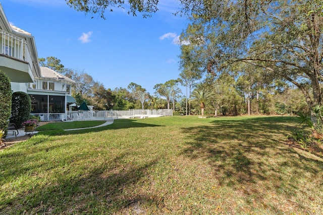 view of yard with a sunroom