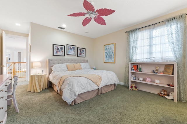 bedroom with ceiling fan and carpet