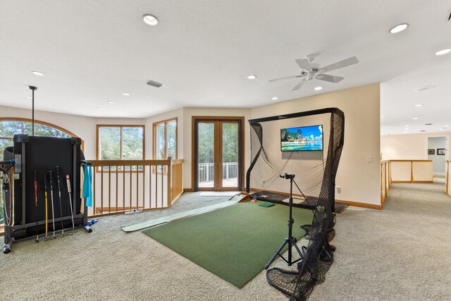 workout area featuring ceiling fan and carpet floors