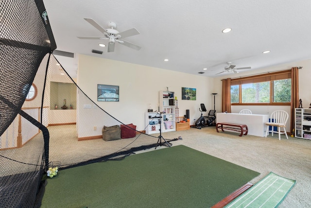 workout room with ceiling fan and carpet floors