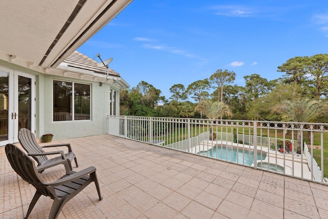 view of patio / terrace featuring a fenced in pool