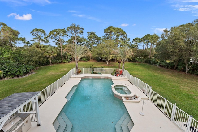 view of pool with an in ground hot tub and a yard