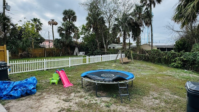 view of yard featuring a trampoline