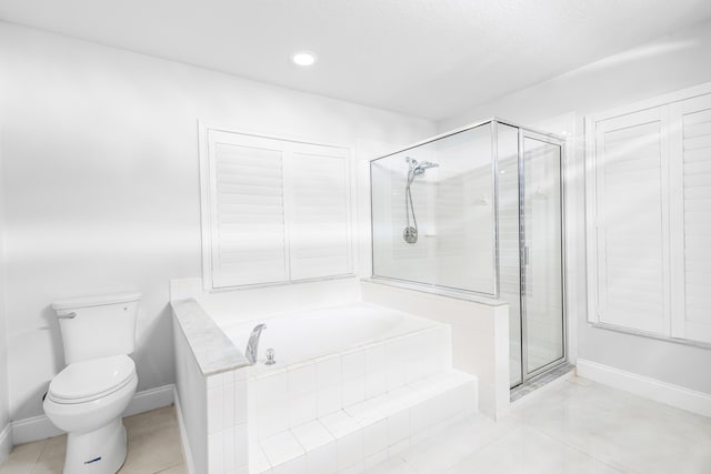 bathroom featuring toilet, shower with separate bathtub, and tile patterned floors