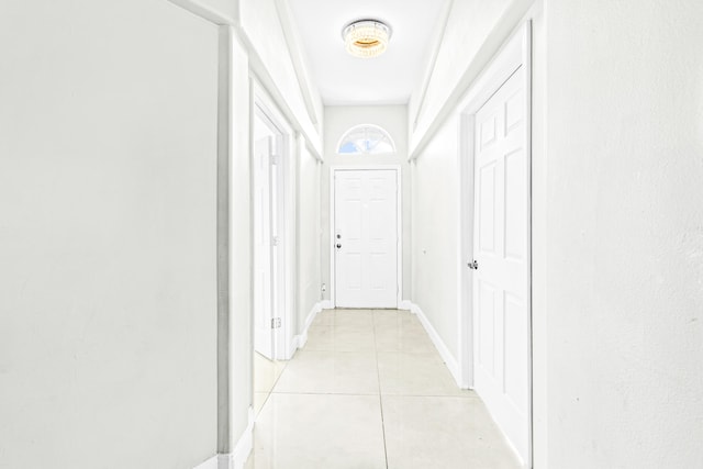 hall with light tile patterned flooring