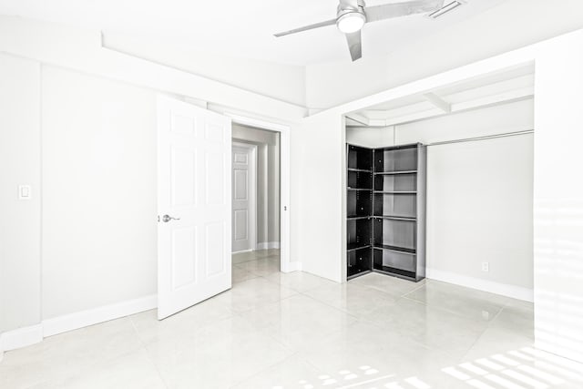 unfurnished bedroom featuring ceiling fan and light tile patterned flooring