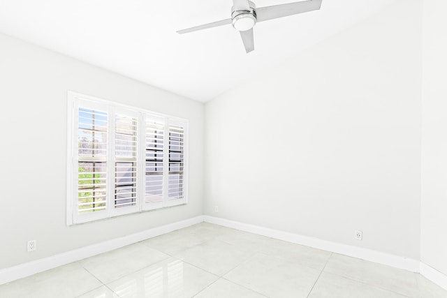 unfurnished room with ceiling fan and light tile patterned floors