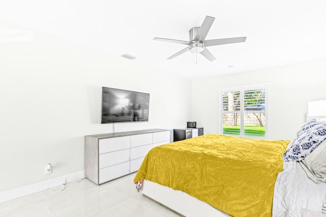 bedroom featuring ceiling fan and light tile patterned floors