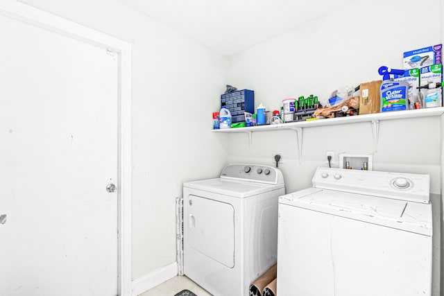 washroom with washing machine and dryer