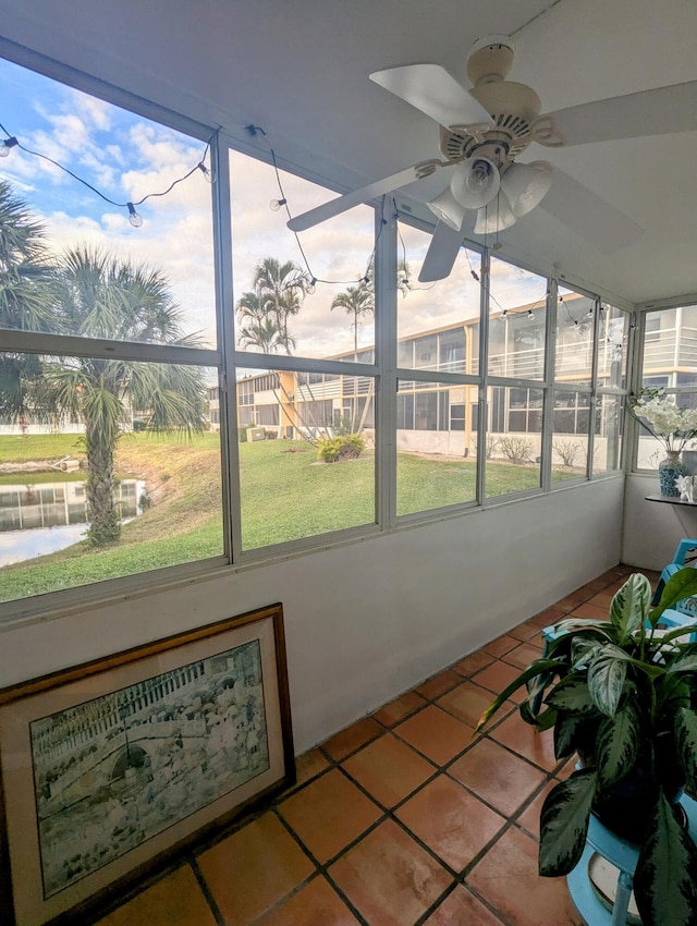 sunroom / solarium featuring ceiling fan