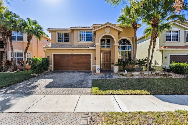 mediterranean / spanish-style home featuring a garage