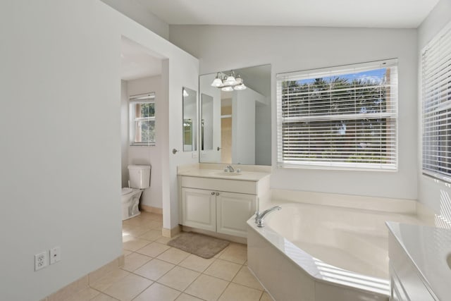 bathroom with tile patterned flooring, toilet, a wealth of natural light, and vaulted ceiling