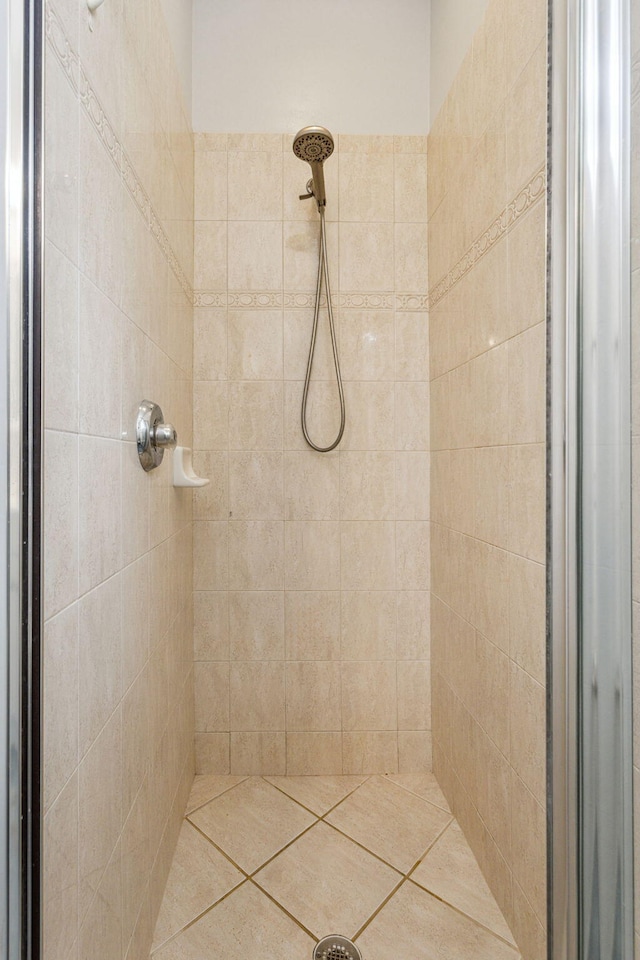 bathroom with tiled shower