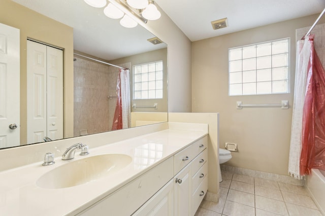 full bathroom with tile patterned floors, vanity, shower / tub combo, and toilet