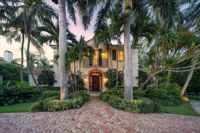 mediterranean / spanish-style house with a balcony