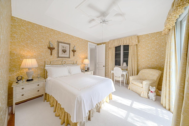 carpeted bedroom with ceiling fan and crown molding