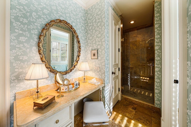 bathroom featuring vanity, tiled shower, and crown molding