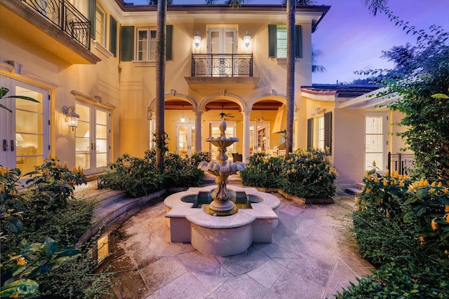 patio terrace at dusk with a balcony