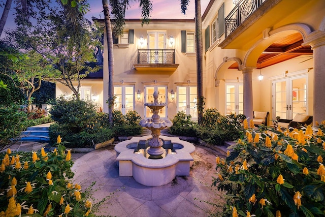 exterior space with french doors, a patio, and a balcony