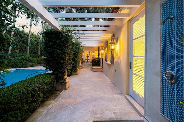 view of patio terrace at dusk