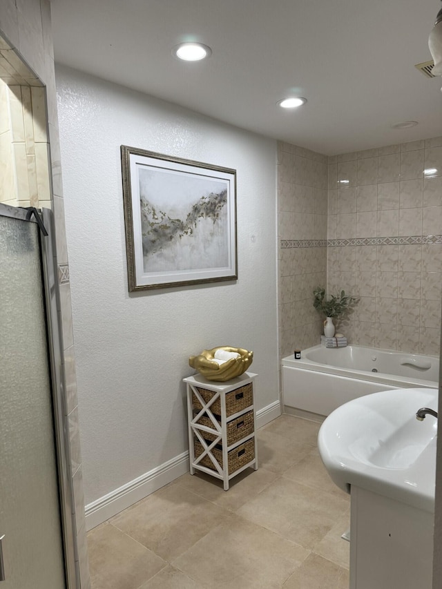 bathroom featuring vanity, tile patterned floors, and separate shower and tub