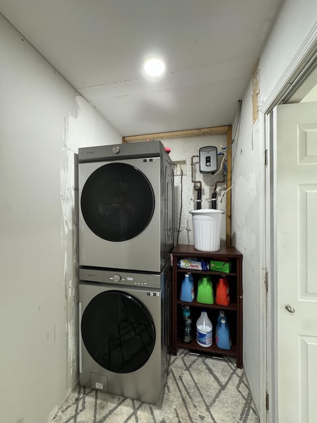 washroom with stacked washer and dryer