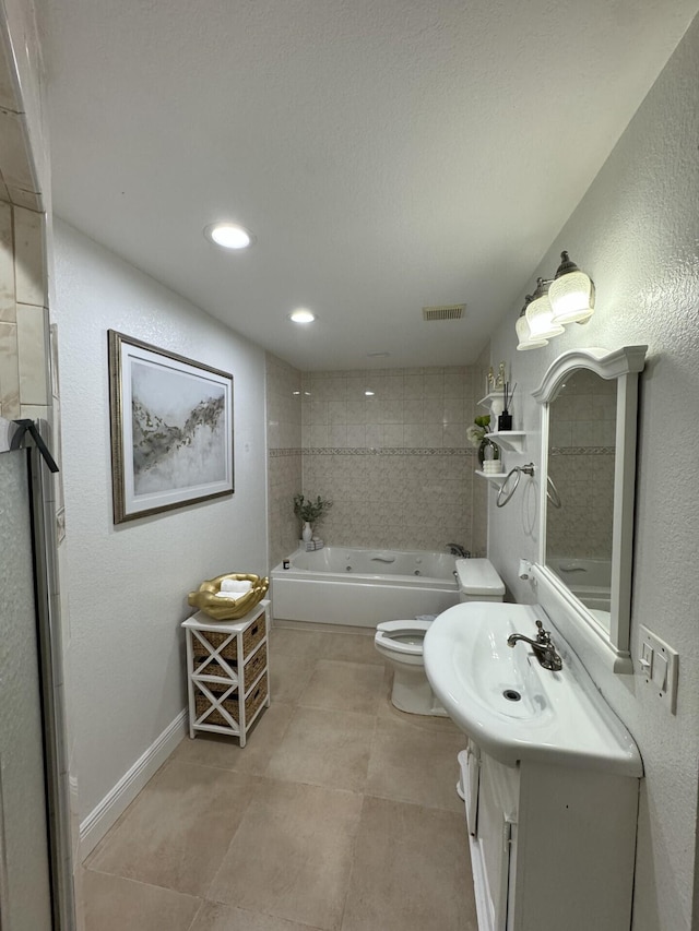 full bathroom with vanity, tiled shower / bath combo, and toilet