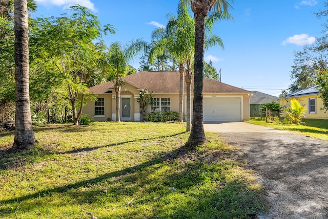 single story home featuring a front yard and a garage