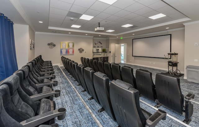 home theater featuring a raised ceiling, crown molding, a drop ceiling, and carpet