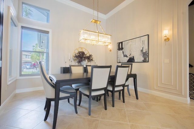 tiled dining space with a notable chandelier and ornamental molding