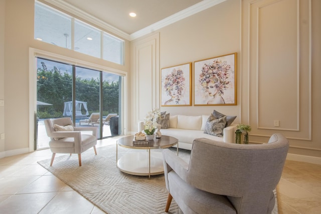 living room featuring a high ceiling, ornamental molding, and light tile patterned floors