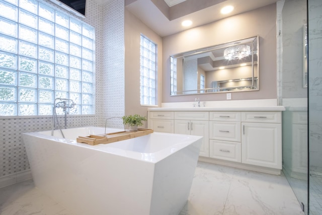 bathroom featuring vanity and a tub