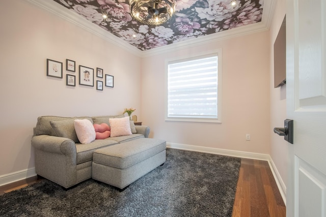 living area with ornamental molding and dark hardwood / wood-style flooring