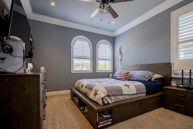 bedroom with ornamental molding and ceiling fan