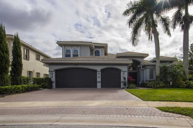 mediterranean / spanish-style home with a front lawn