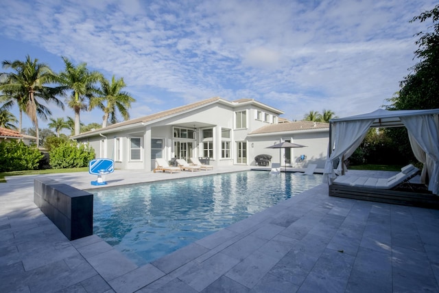 view of swimming pool with a patio