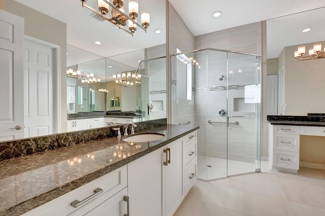 bathroom with tile patterned flooring, vanity, and an enclosed shower