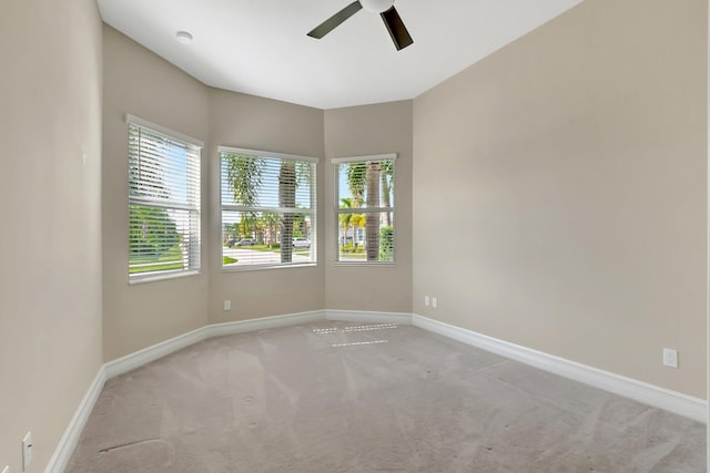 carpeted empty room with ceiling fan