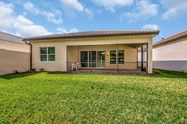 rear view of house with a lawn